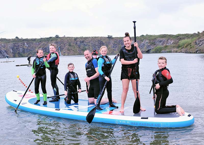 A group of children using the CST Mega SUP