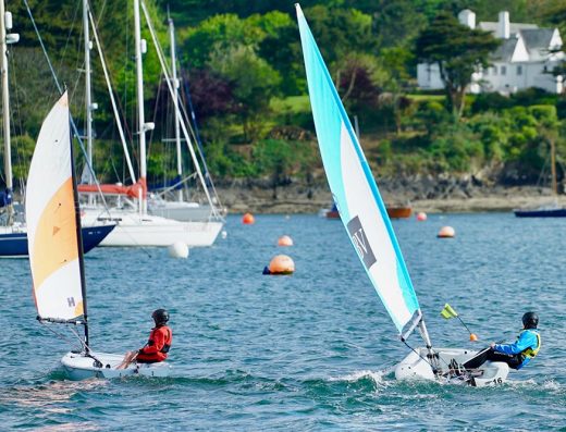 children sailing the accessible dinghies on the Helford River