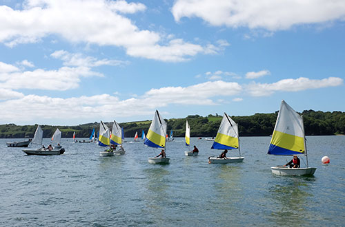 Racing sailing boats on the river with CST Experiences