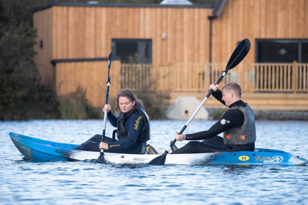 A couple using a double kayak on Trevassack Lake