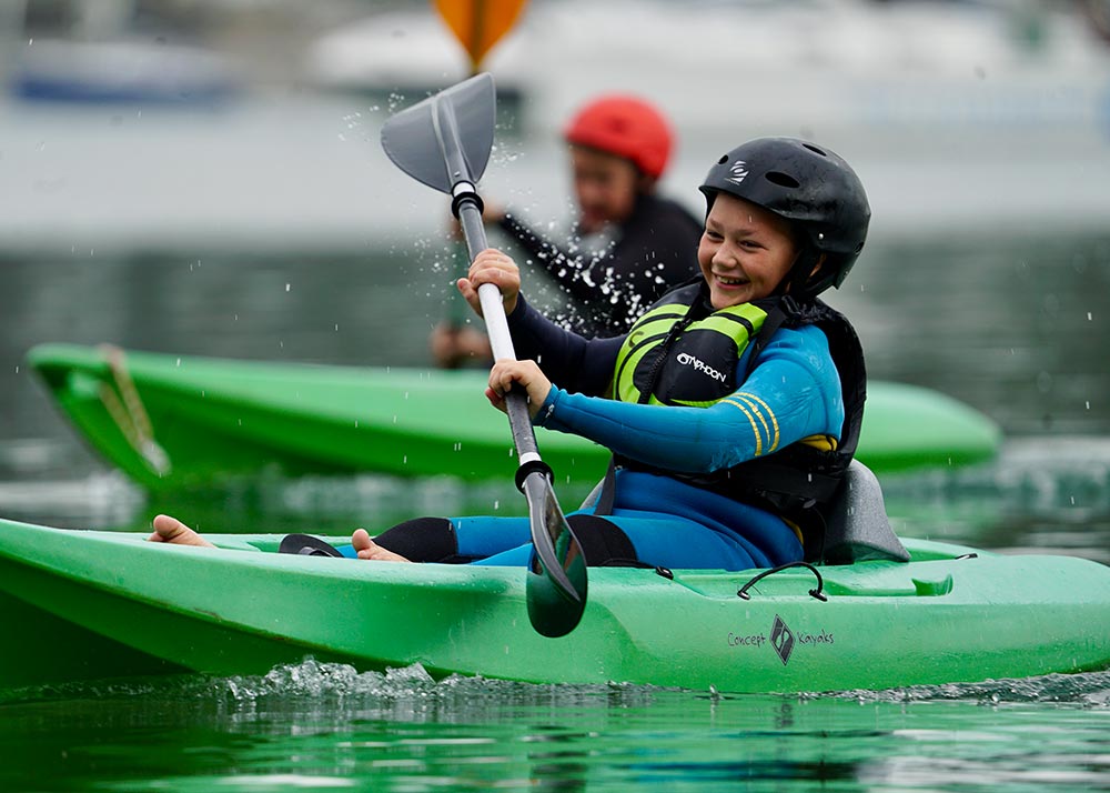 children having fun kayaking