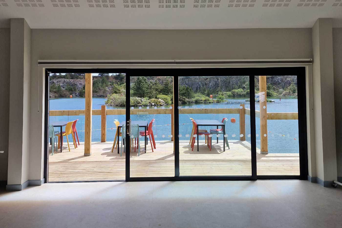 Large patio doors open the function room up to the deck and lake